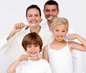 Mother and Father are brushing their teeth with their son and daughter