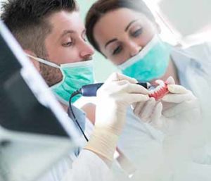 Dentists are examine a denture